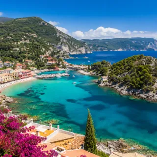 Mediterranean coastal village above a turquoise bay