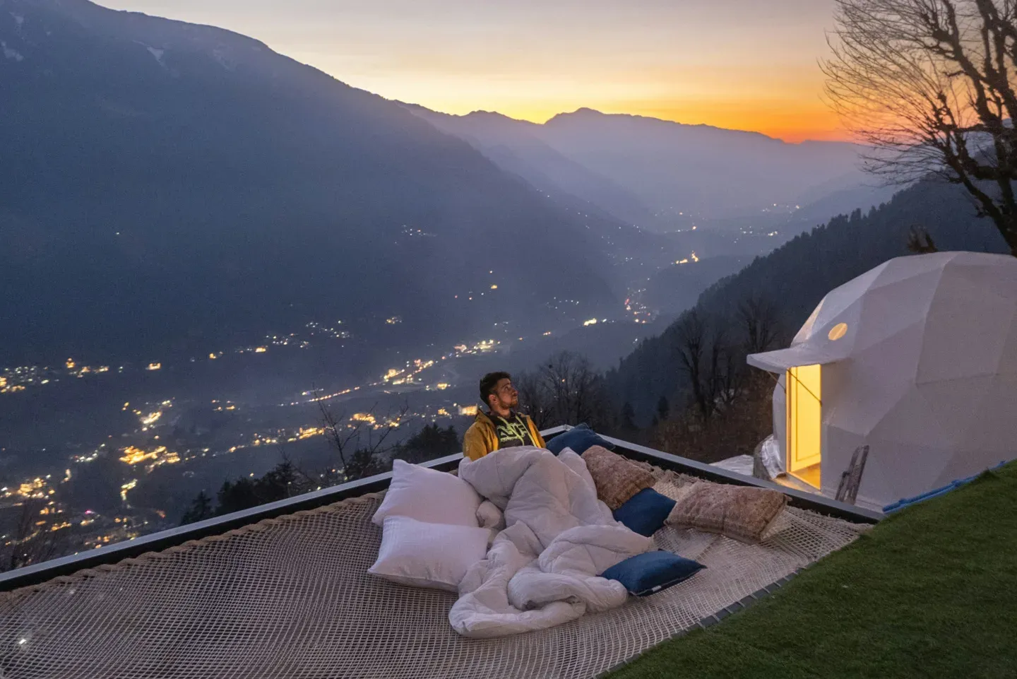 Glamping dome on a cliff at twilight