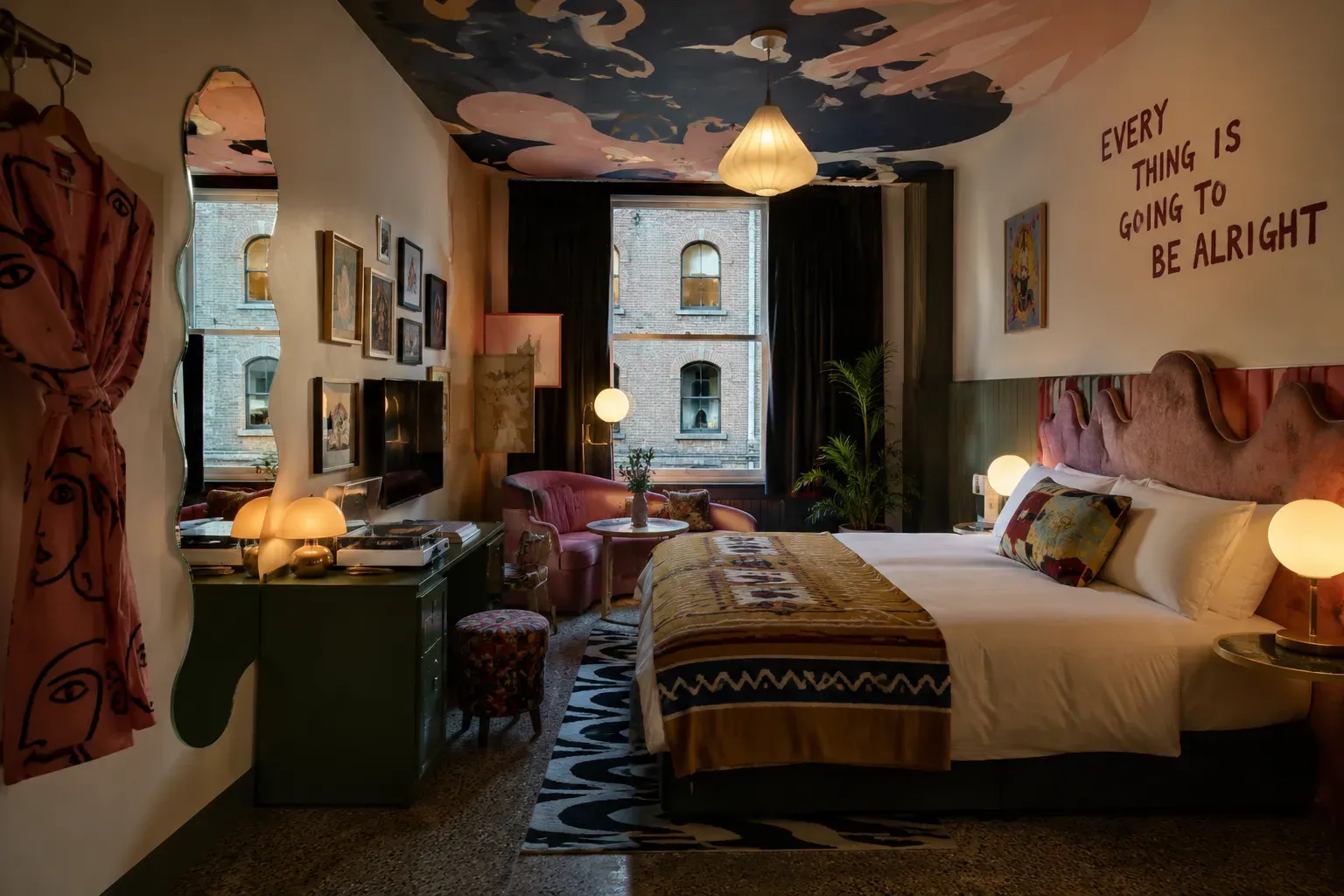 Eclectic boutique hotel room with hand-painted ceiling and warm lamplight