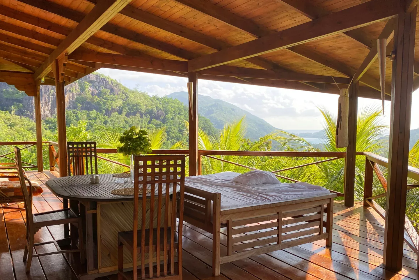 Open wooden pavilion in a jungle setting