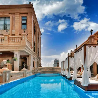 Grand hotel exterior with twin poolside cabanas