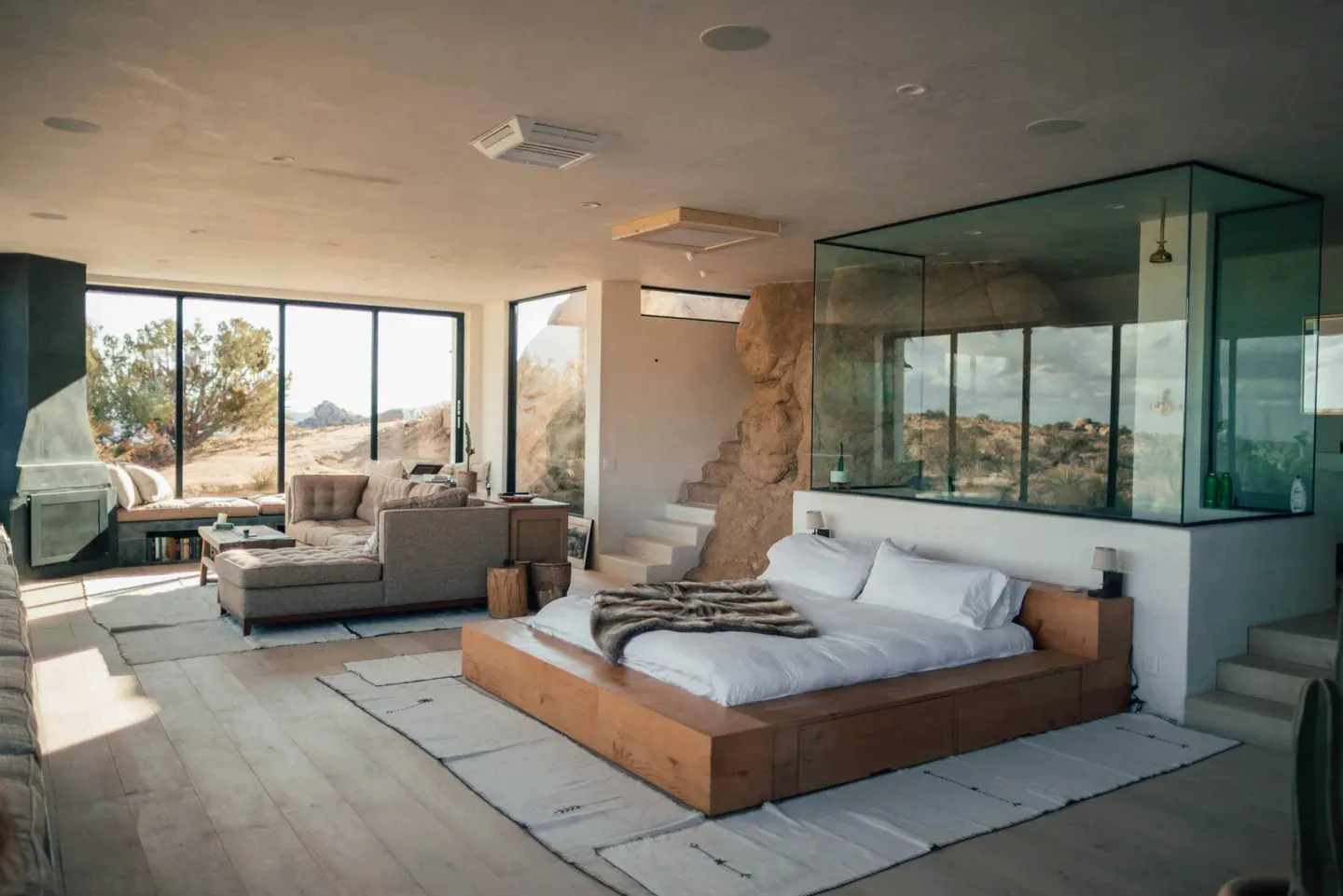 Desert house bedroom with glass shower box