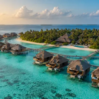 Overwater bungalows in a Maldives lagoon at sunrise