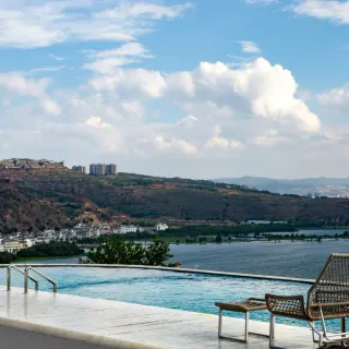 Elevated pool overlooking a coastal city skyline