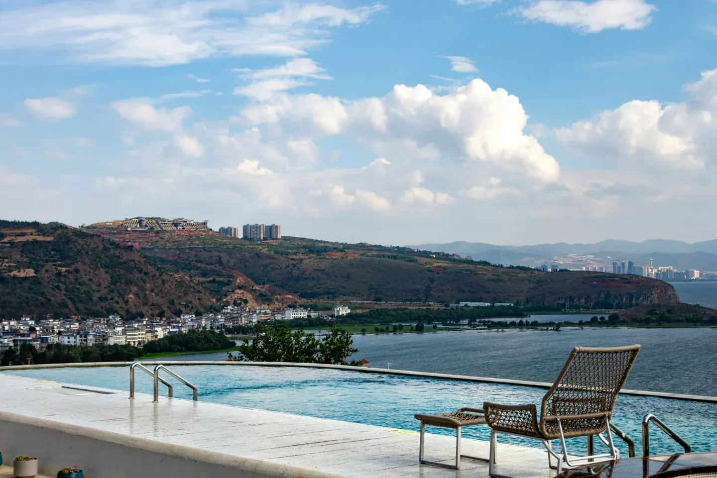 Elevated pool overlooking a coastal city skyline