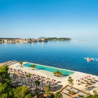 Aerial view of the infinity pool by the sea at Valamar Pical Resort
