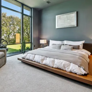 Soft-lit modern hotel bedroom