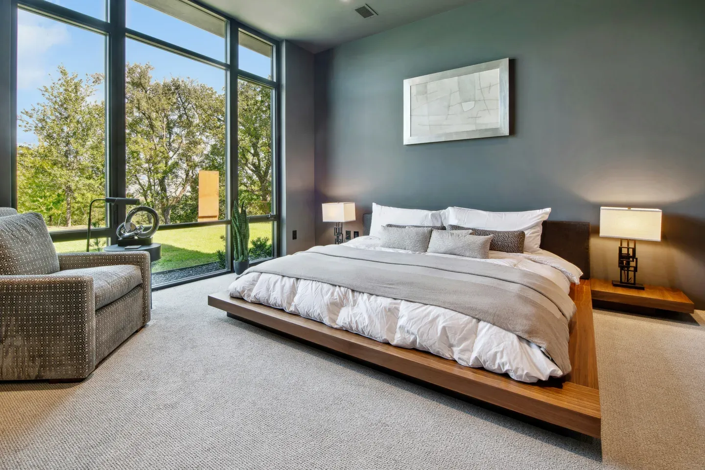 Soft-lit modern hotel bedroom