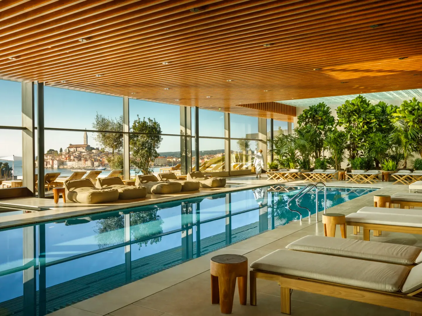 Indoor infinity pool at Grand Park Hotel Rovinj with floor-to-ceiling views over the Rovinj coast