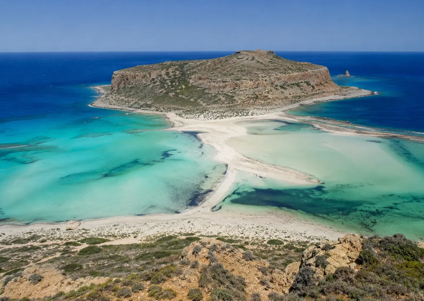 A secluded island and turquoise lagoon off Crete