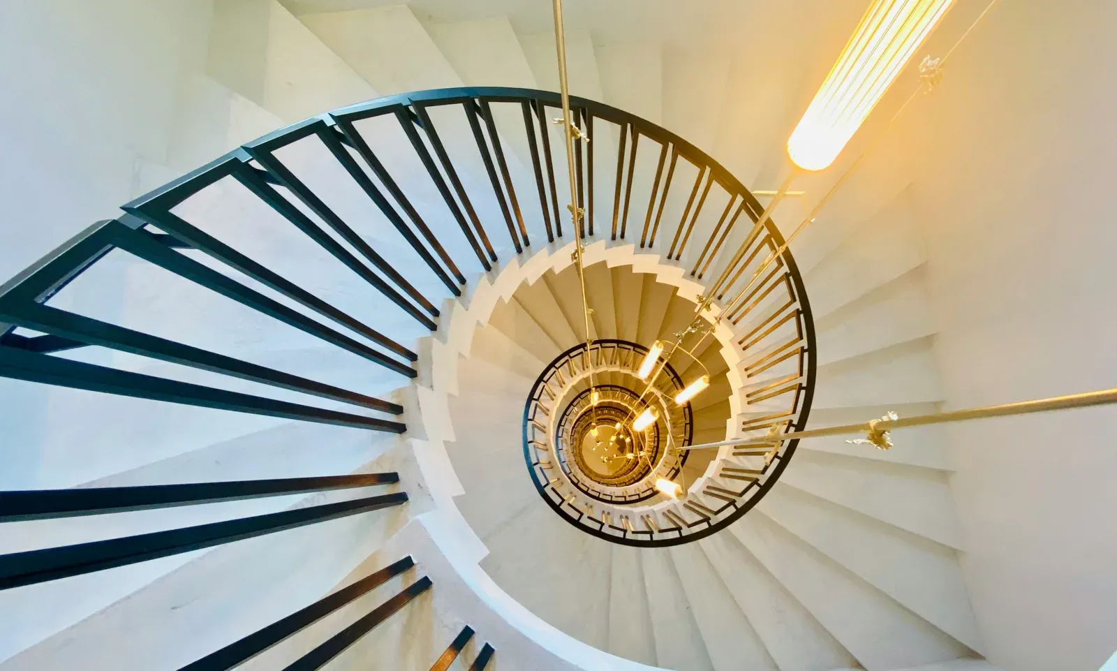 Sculptural spiral staircase viewed from below, modern architecture