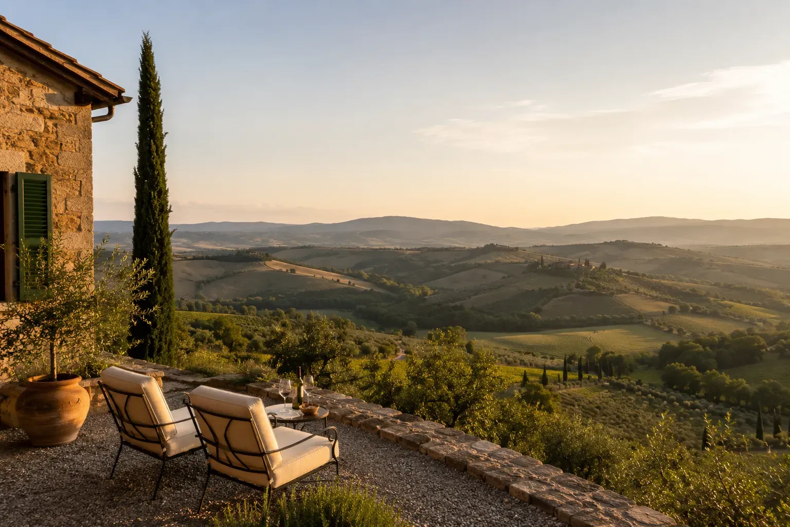 Terrace loungers overlooking the Tuscan hills at golden hour