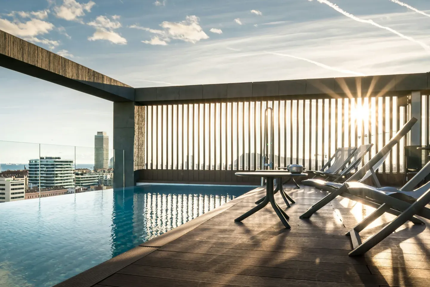 Rooftop infinity pool framing a city skyline