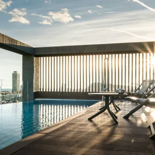 Rooftop infinity pool framing a city skyline